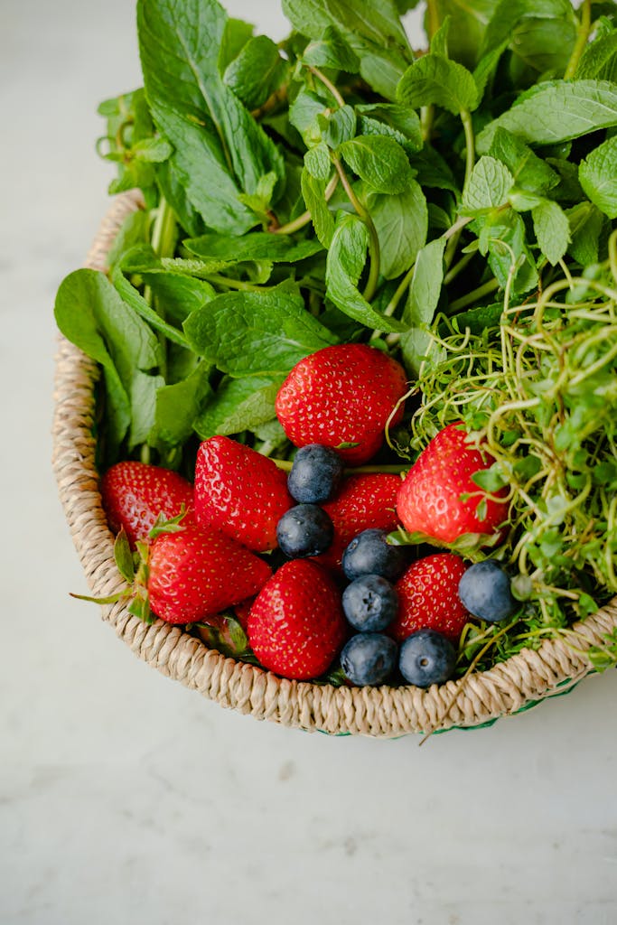 Green Vegetables and Fruits in a Basket